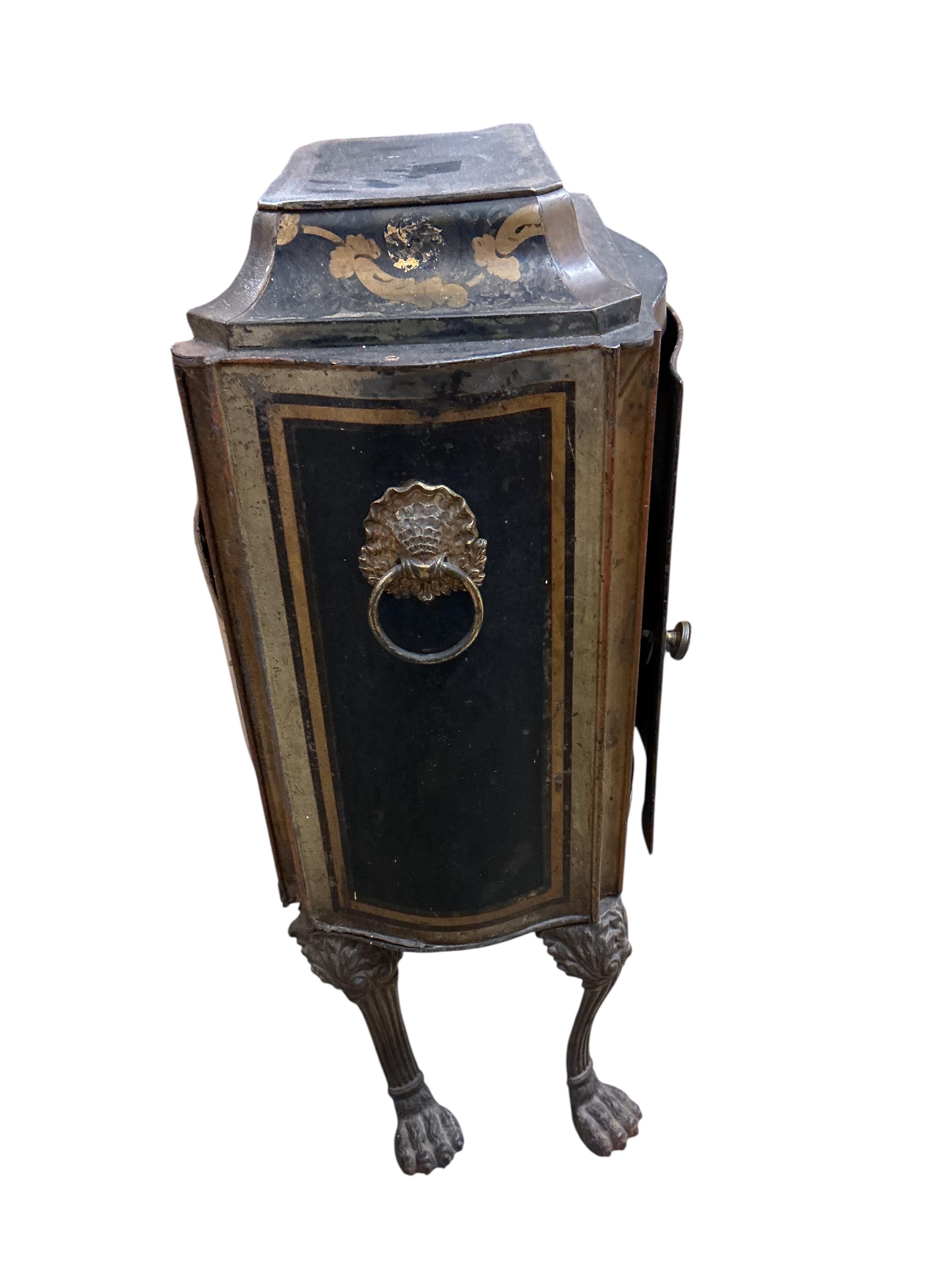 An early 19th century toleware serpentine cabinet, with gilt decoration, width 40cm, depth 30cm, height 76cm